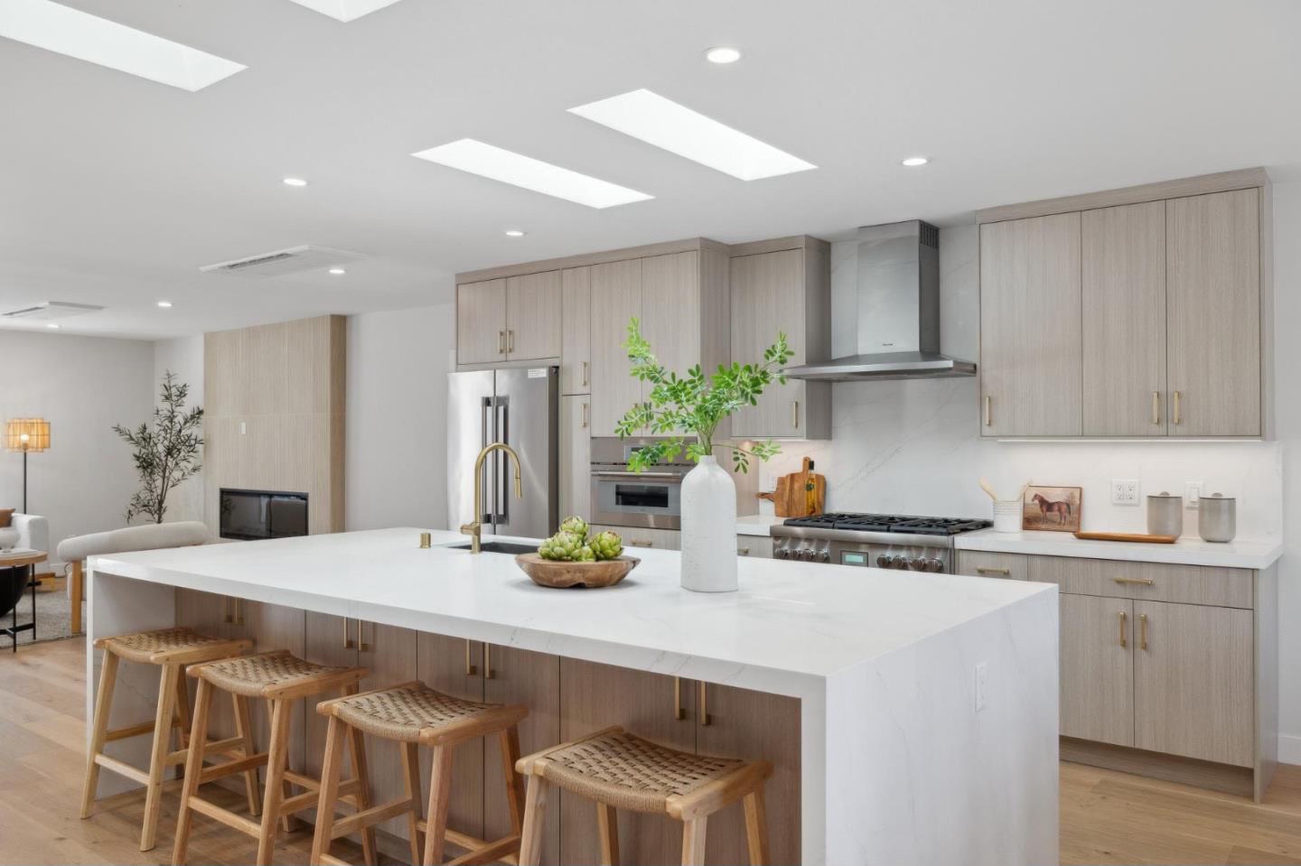 Kitchen island with seating under skylights