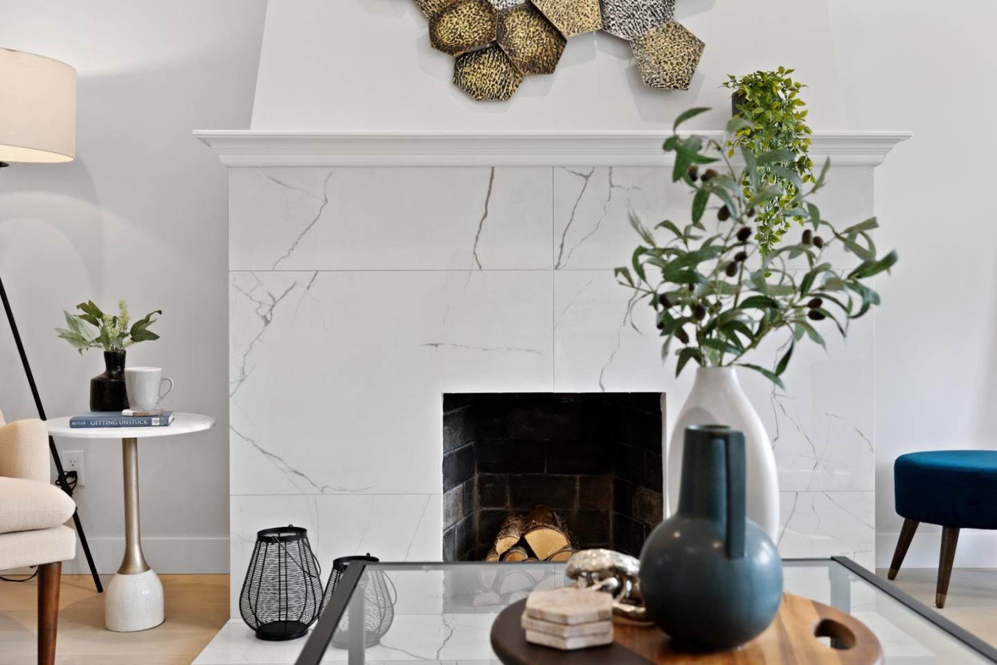 Marble-clad fireplace with decorative vases