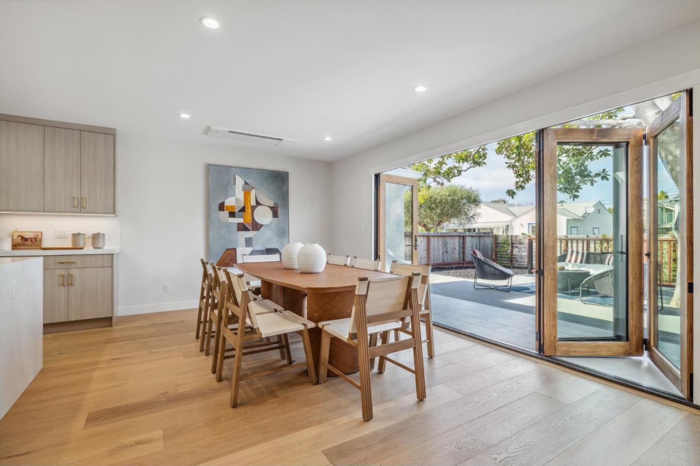 Open concept dining room with folding glass doors