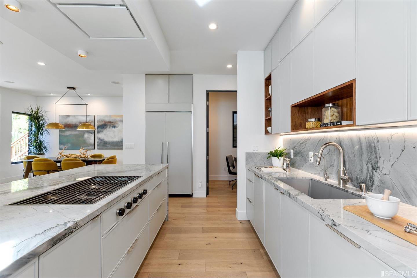 White kitchen with integrated cooktop